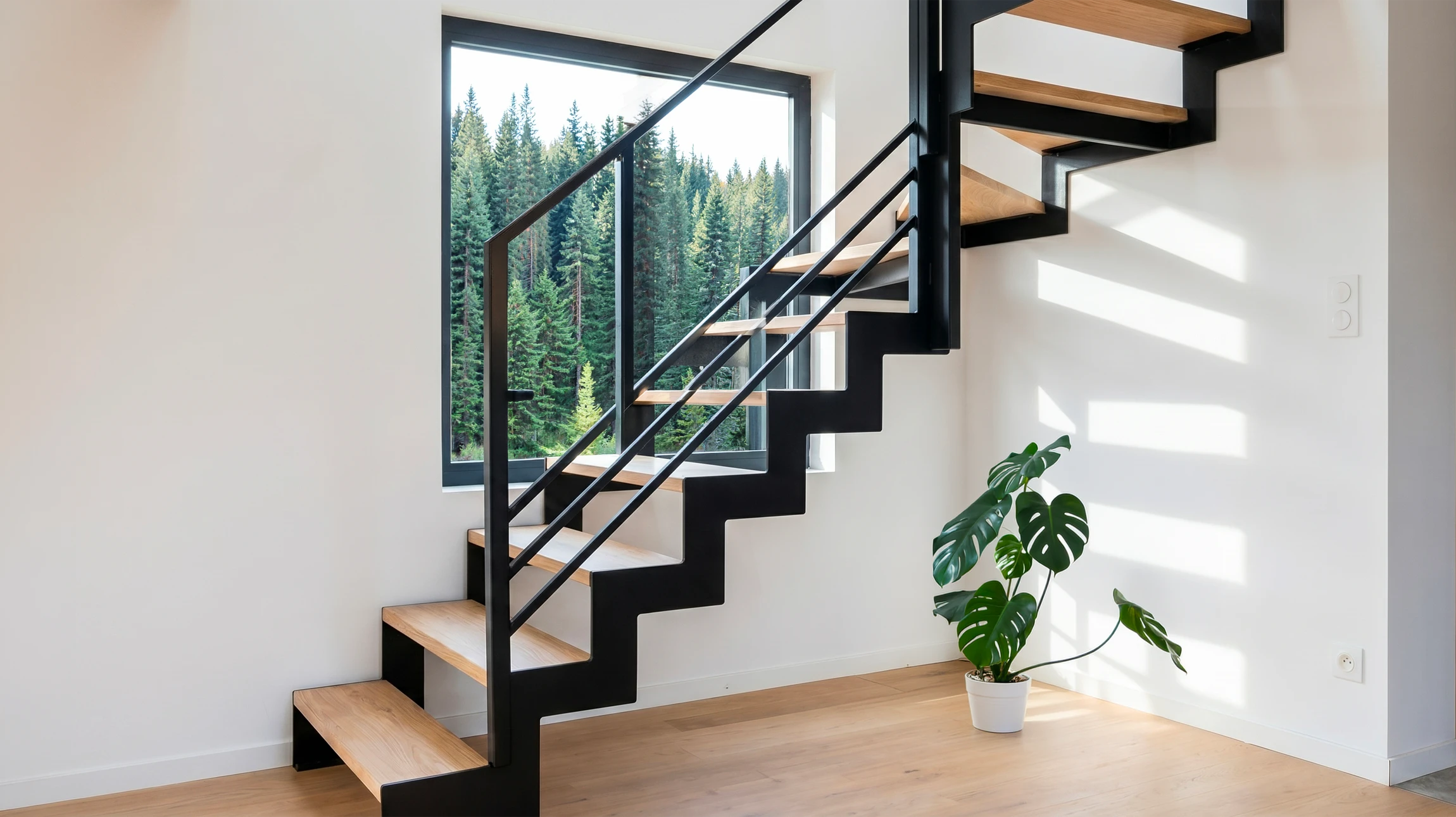 Escalier intérieur moderne en béton avec rampe métallique inox